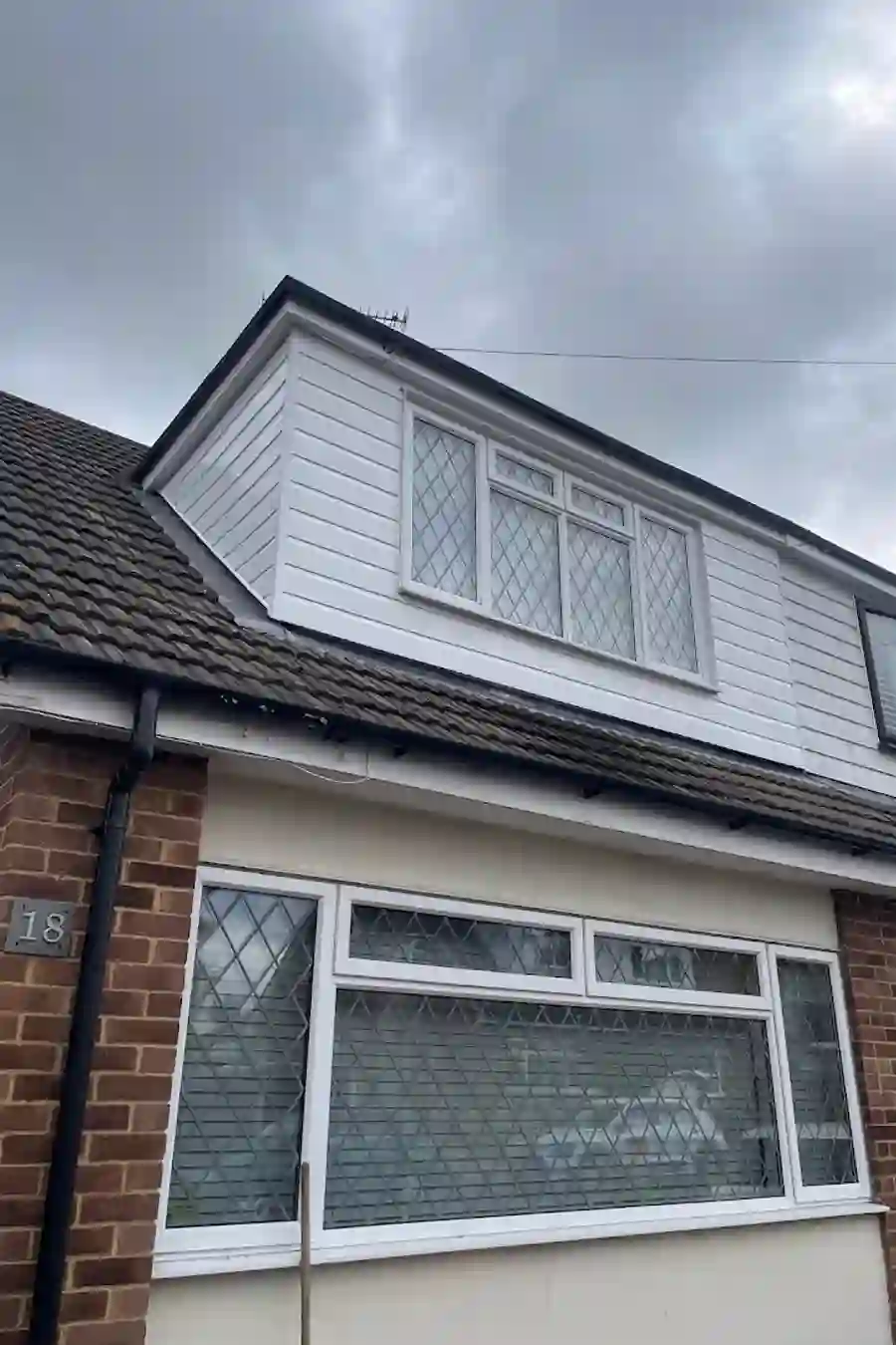 Completed dormer extension with white render
