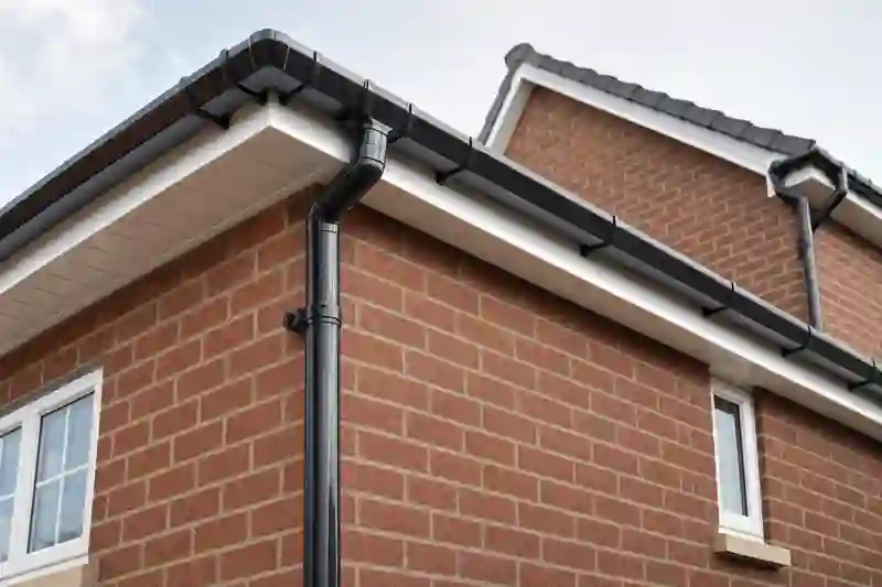 New uPVC guttering and downpipes on a brick house